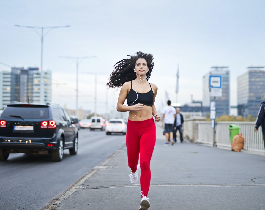 photo of woman listening to music on earphones running down 3764537 — emotional wellbeing emotional wellbeing