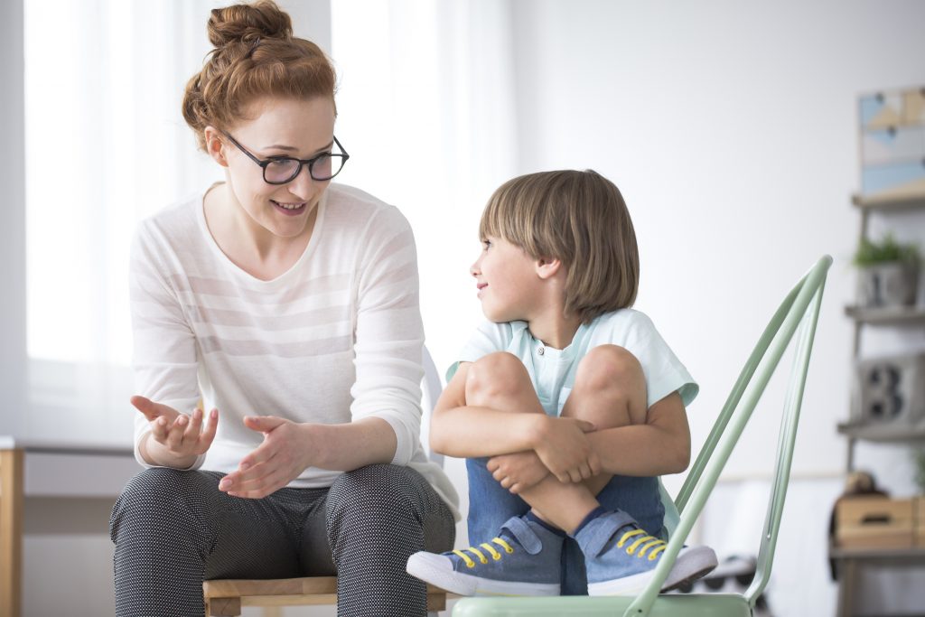 mother talking to smiling son PTYXSQ6 optimised 1024x683 1 — happiness happiness